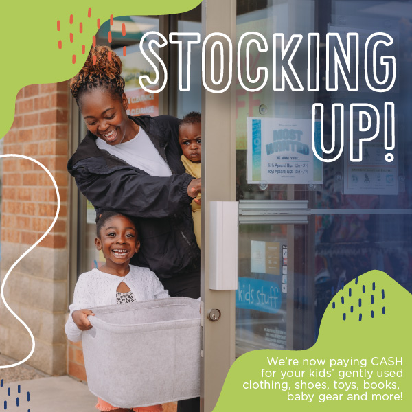 a happy family walking out of a Once Upon a Child store with an empty basket after donating their gently used goods.